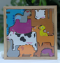 Wooden animal puzzle with colorful, organic, handcrafted farm animal pieces for toddlers.